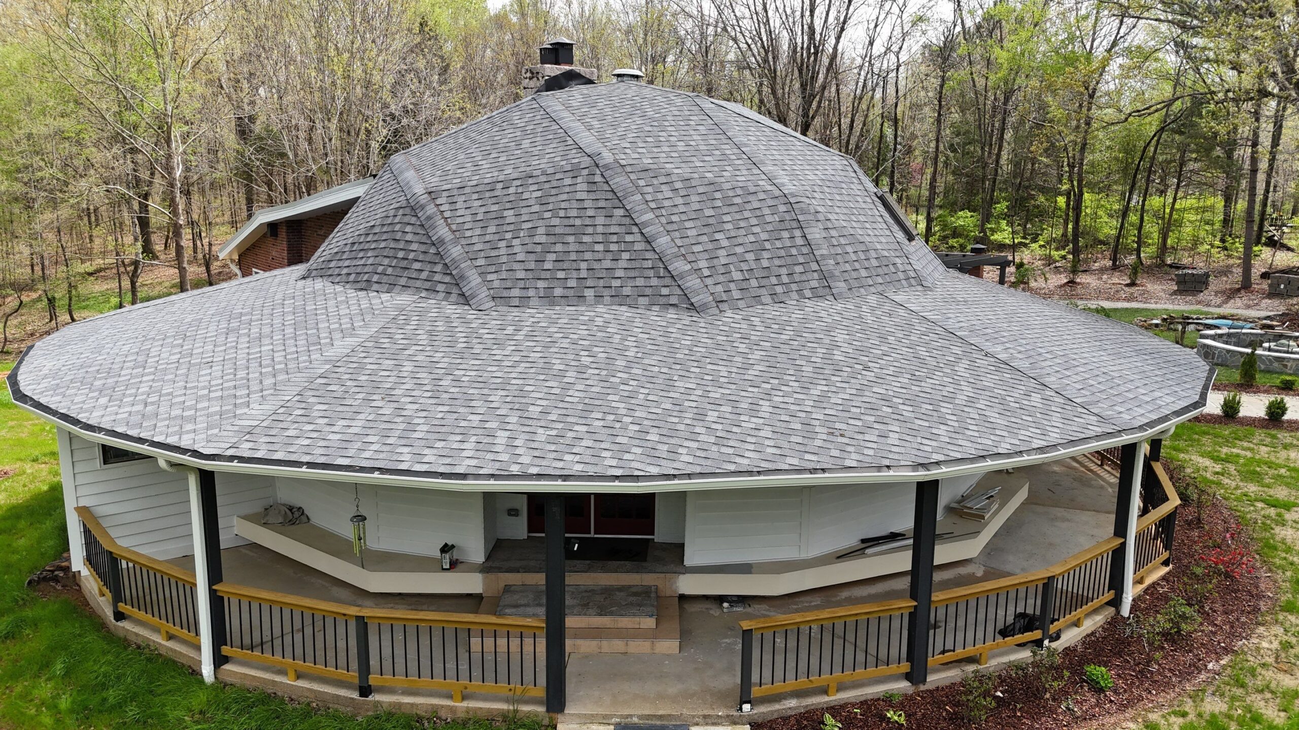 Intricate roof replacement in a home with multiple hips and ridges in Fairview, TN - Before