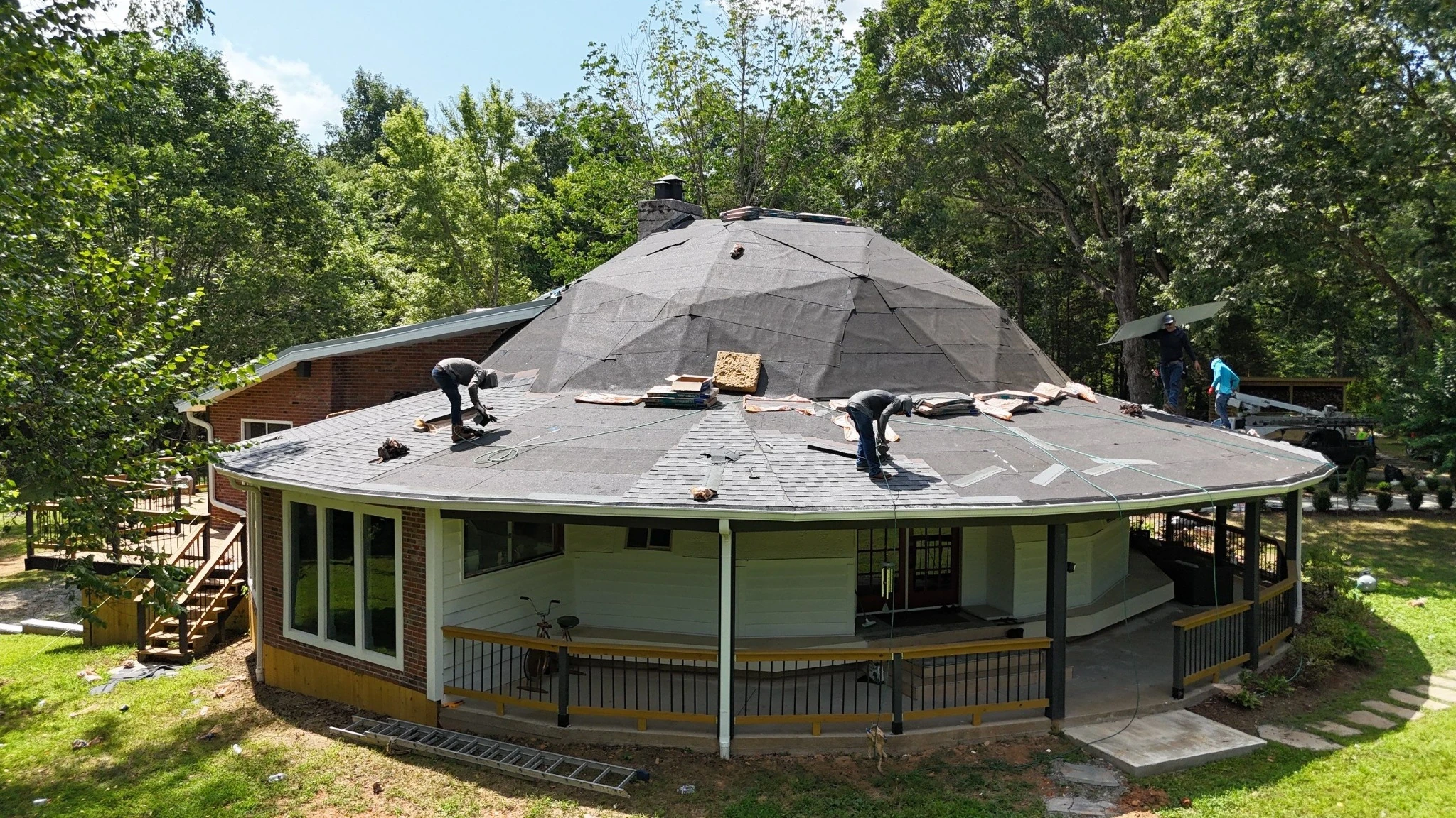 Intricate roof with numerous hips and ridges during shingle installation in Fairview, TN