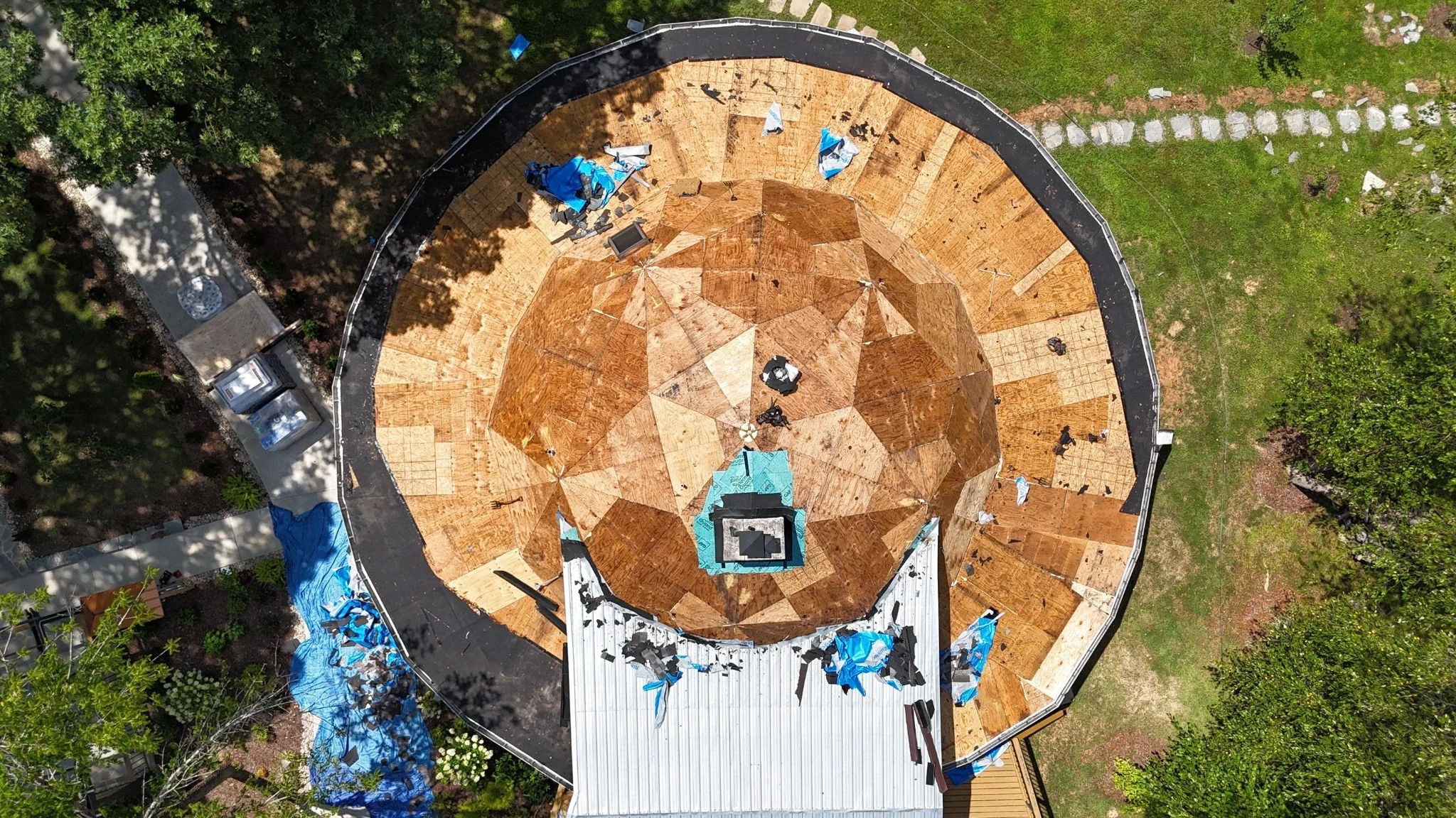 Old roof being removed down to the decking during a roof replacement in Fairview, TN