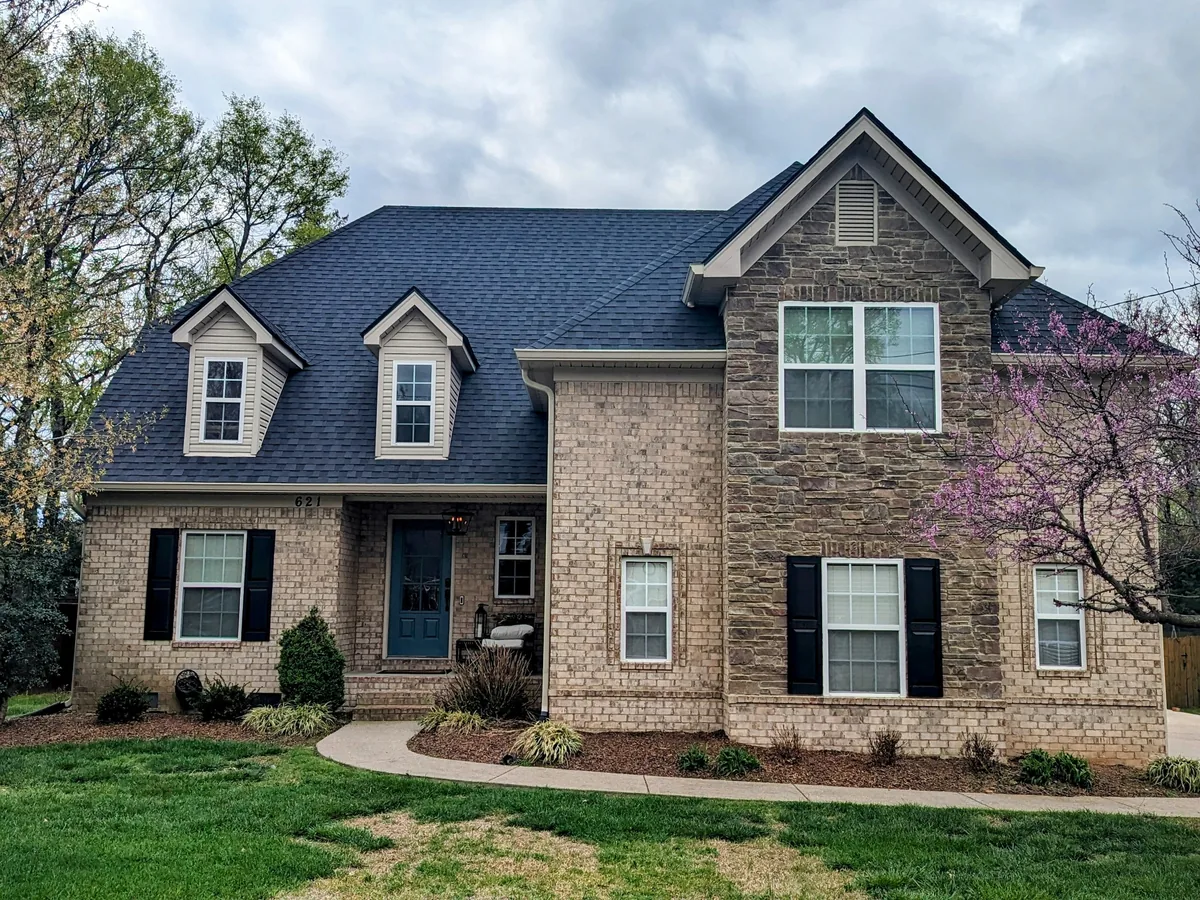 CertainTeed Moire Black shingle roof installed on a brick and stone home in Columbia, TN
