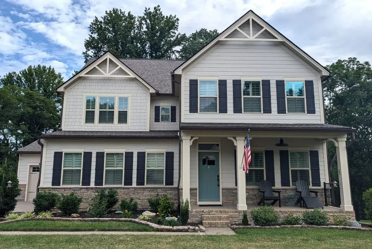 New architectural shingle roof installed on a craftsman-style home