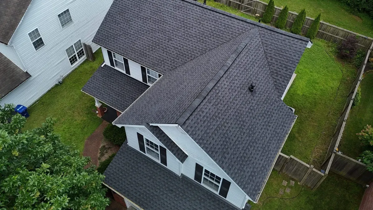 New dark asphalt shingle roof installed on a two-story home