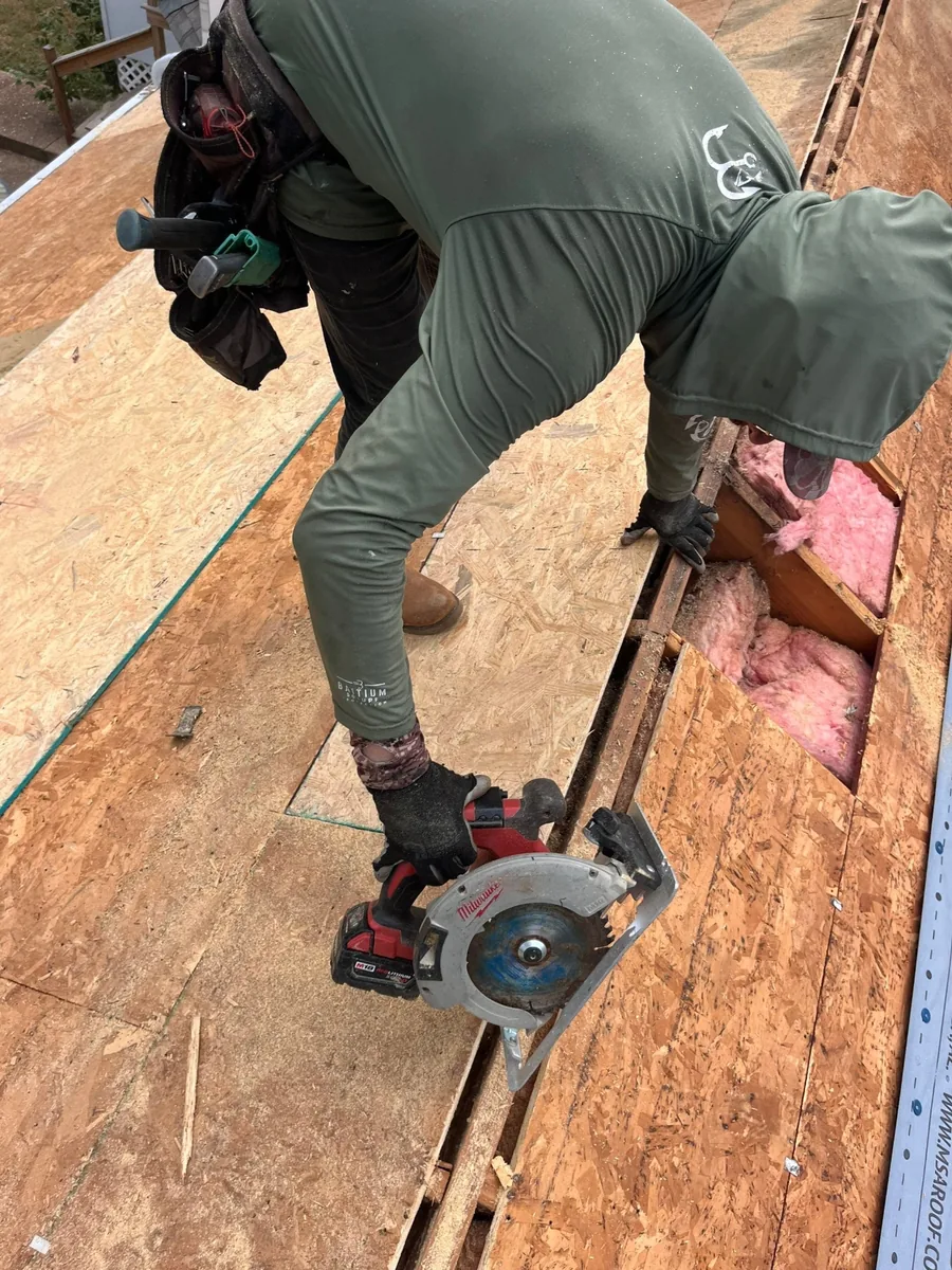 Quality RRC roofer preparing roof decking during a roof installation in Columbia, TN