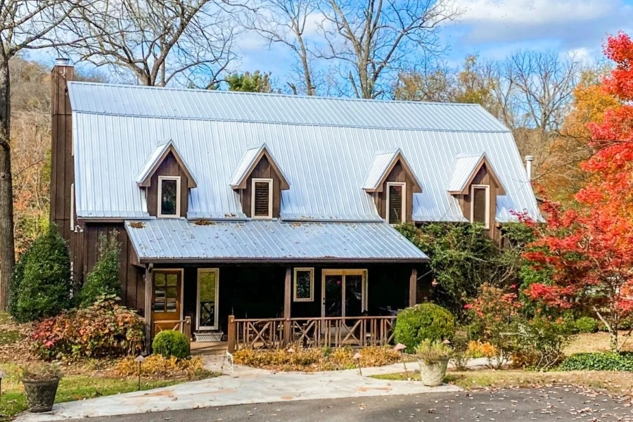 Metal roof with dormers above a covered porch on a Nashville home